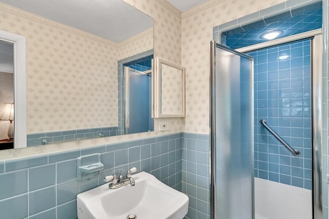 27 Philip Rd, Lexington, MA 02421 - full bathroom with wallpapered walls, a sink, a shower stall, ensuite bath, and a wainscoted wall