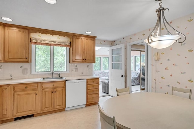 27 Philip Rd, Lexington, MA 02421 - kitchen featuring white dishwasher, a sink, wallpapered walls, decorative backsplash, and light countertops