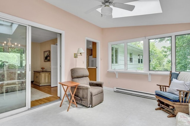 27 Philip Rd, Lexington, MA 02421 - living area with a baseboard radiator, a ceiling fan, plenty of natural light, vaulted ceiling, and a skylight