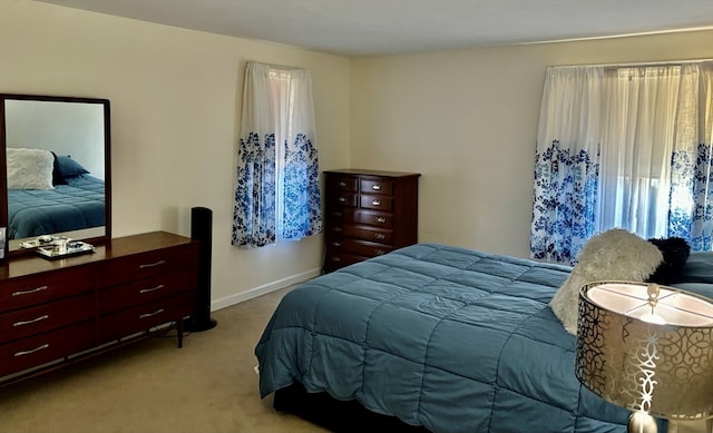 bedroom with light colored carpet