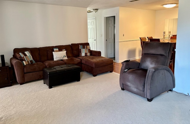 living room featuring light carpet