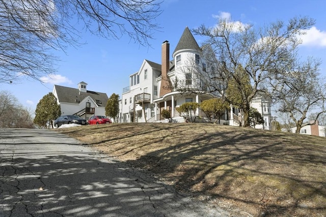 view of side of home with a lawn