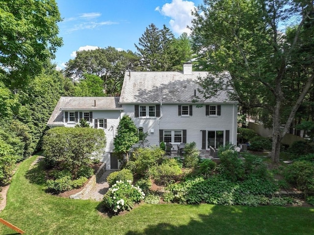 271 Greenwood St, Newton, MA 02459 - rear view of property featuring a chimney and a lawn