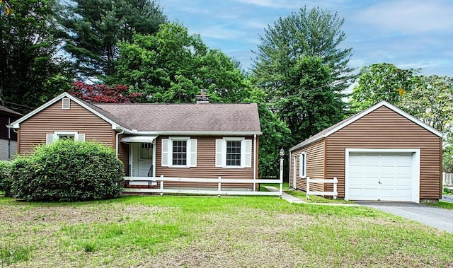 188 N Maple St, Northampton, MA 01062 - ranch-style home with a chimney, a front yard, a garage, asphalt driveway, and a shingled roof