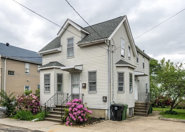 57 Prospect St, Watertown, MA 02472 - view of front of home with a shingled roof