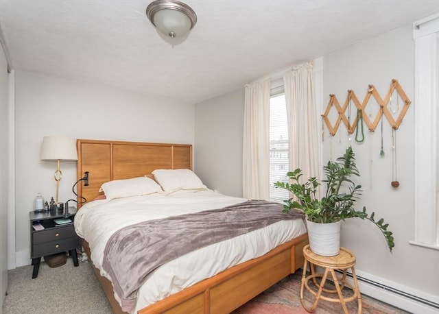 57 Prospect St, Watertown, MA 02472 - carpeted bedroom with a baseboard radiator