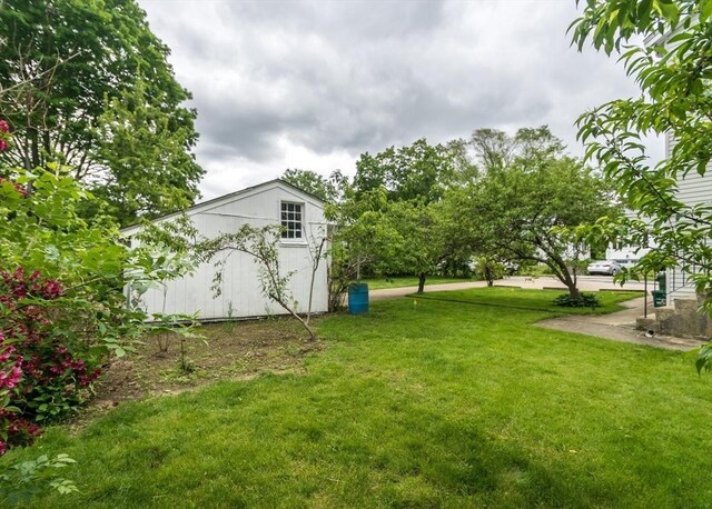 57 Prospect St, Watertown, MA 02472 - view of green lawn featuring an outbuilding