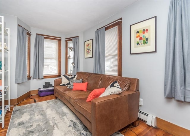 57 Prospect St, Watertown, MA 02472 - living room featuring baseboard heating and wood finished floors