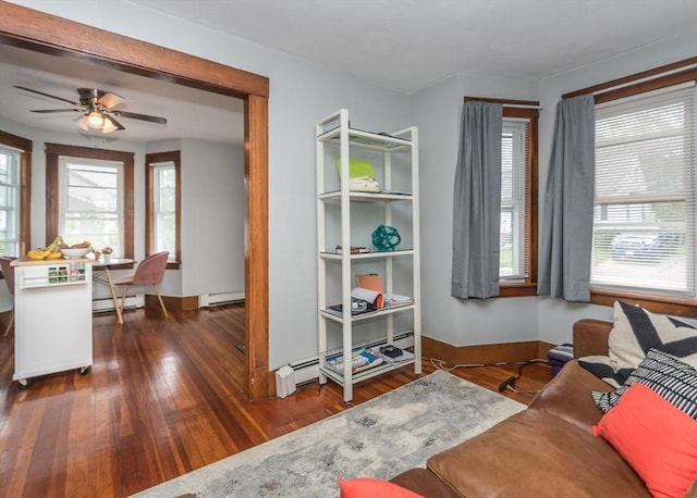 57 Prospect St, Watertown, MA 02472 - living area featuring hardwood / wood-style floors, ceiling fan, baseboard heating, and baseboards