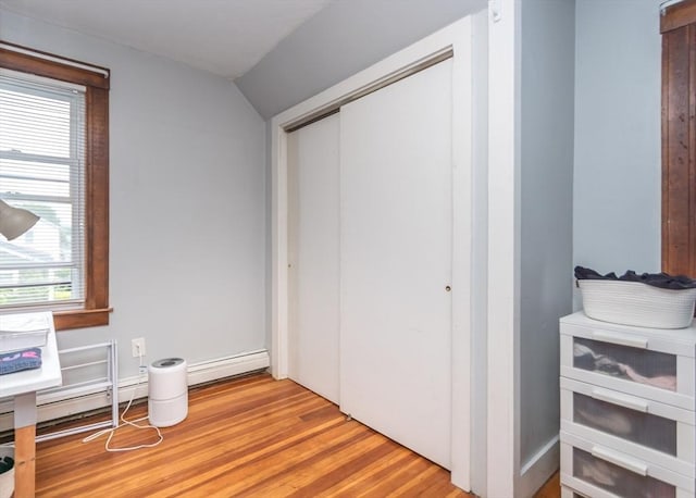 57 Prospect St, Watertown, MA 02472 - bedroom with light wood-style flooring, a closet, and lofted ceiling