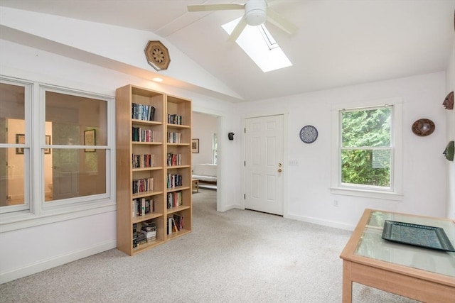 48 Northern Ave Unit 48, Northampton, MA 01060 - foyer featuring vaulted ceiling, ceiling fan, a skylight, light carpet, and baseboards