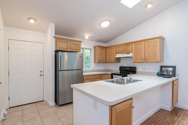 48 Northern Ave Unit 48, Northampton, MA 01060 - kitchen featuring freestanding refrigerator, under cabinet range hood, black / electric stove, a peninsula, and light countertops
