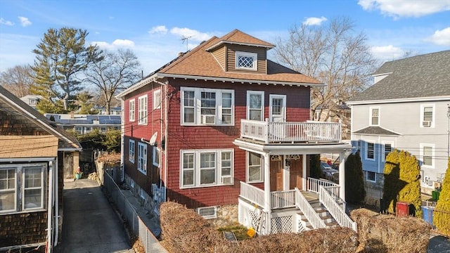 view of front of property with a balcony