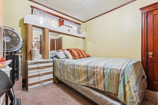 carpeted bedroom featuring crown molding