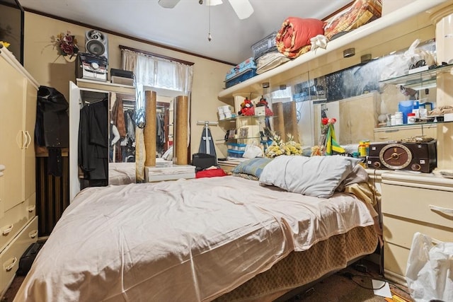 bedroom with ornamental molding and ceiling fan