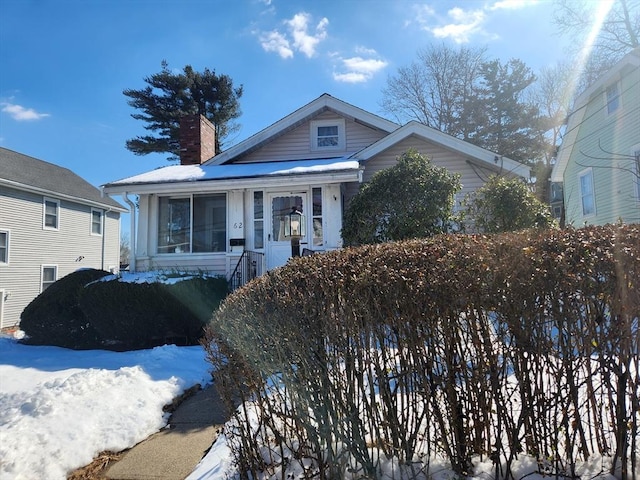 bungalow-style house with a chimney