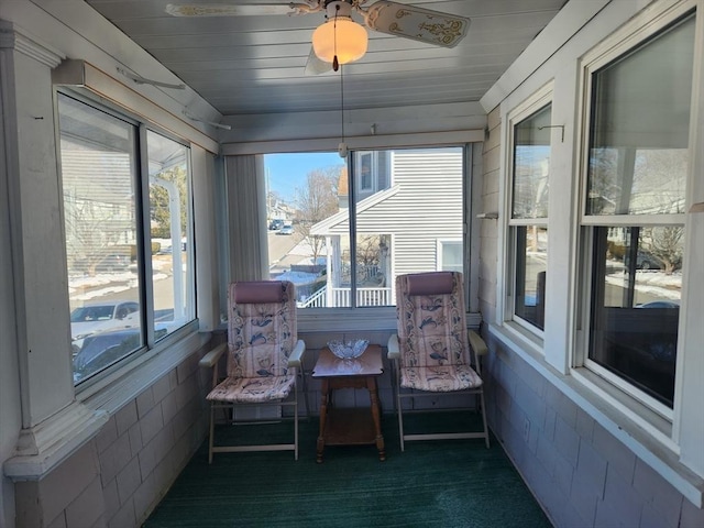 sunroom / solarium featuring wood ceiling and plenty of natural light