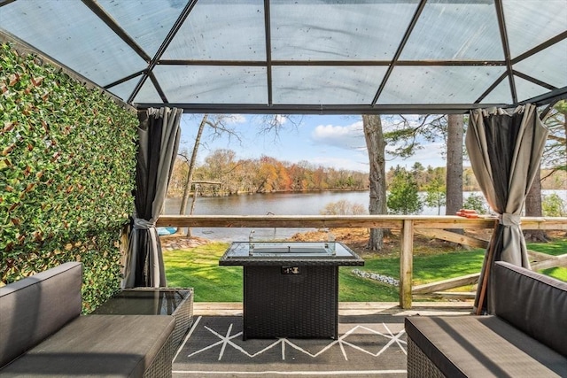 wooden terrace with a water view and a gazebo