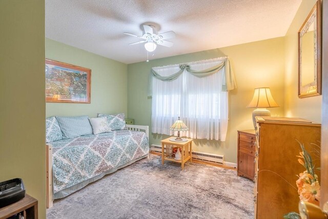 bedroom with baseboard heating, a textured ceiling, and ceiling fan