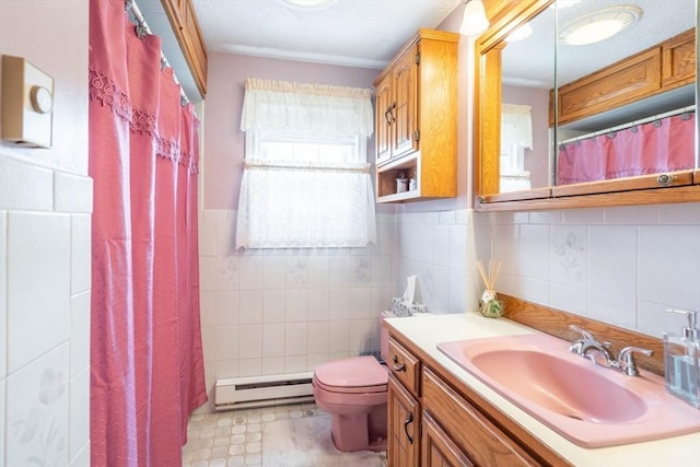 bathroom with baseboard heating, tile walls, toilet, vanity, and a shower with curtain