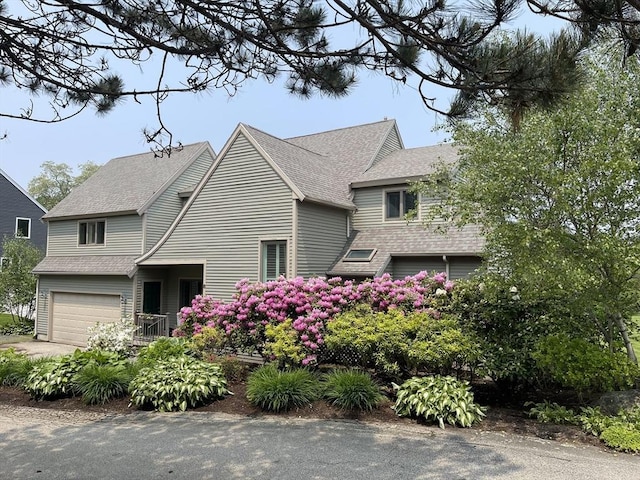 8 Barn Ln, Gloucester, MA 01930 - view of home's exterior featuring an attached garage and roof with shingles