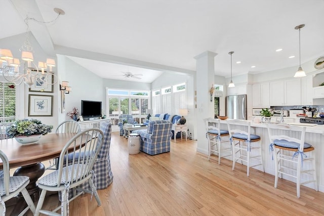 8 Barn Ln, Gloucester, MA 01930 - dining space featuring light wood-style floors, ceiling fan, vaulted ceiling, recessed lighting, and a chandelier