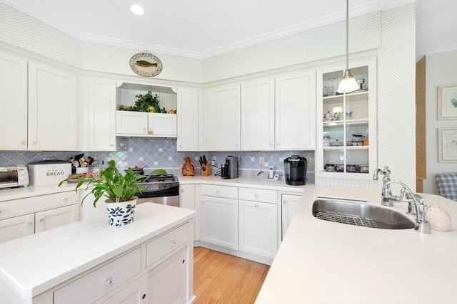 8 Barn Ln, Gloucester, MA 01930 - kitchen with light countertops, tasteful backsplash, white cabinets, and pendant lighting