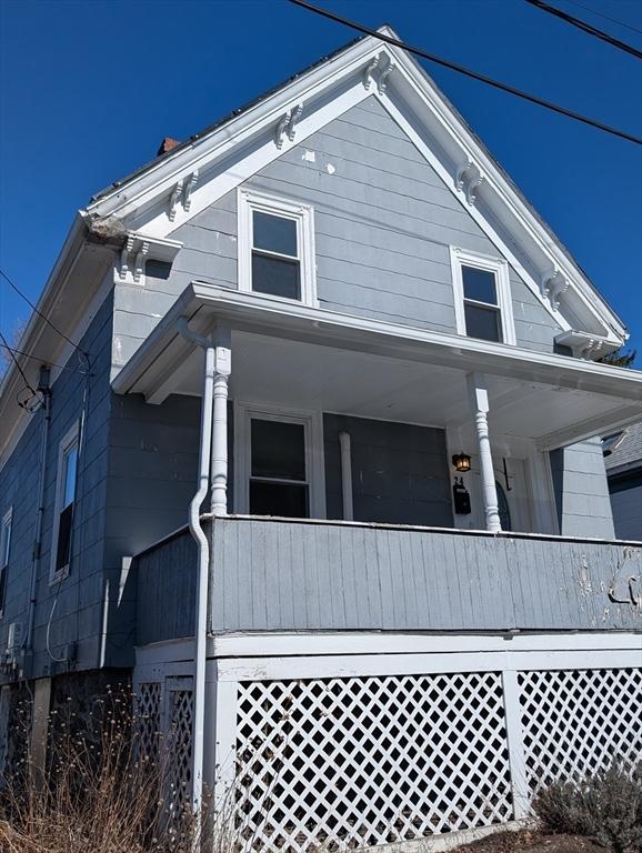 view of property exterior featuring covered porch