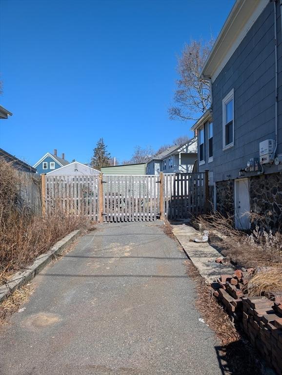 view of gate with fence