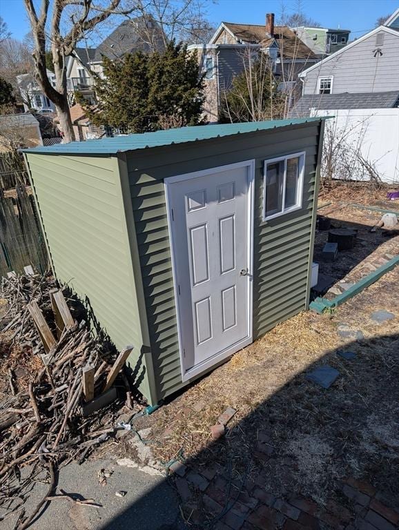 view of shed with fence