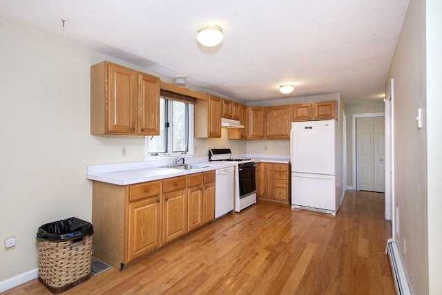 kitchen with under cabinet range hood, white appliances, a baseboard radiator, and light wood-style floors