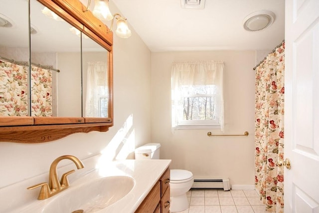 bathroom featuring toilet, a baseboard heating unit, vanity, baseboards, and tile patterned floors