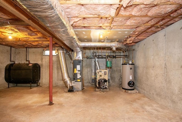 unfinished basement featuring heating fuel, water heater, and a heating unit