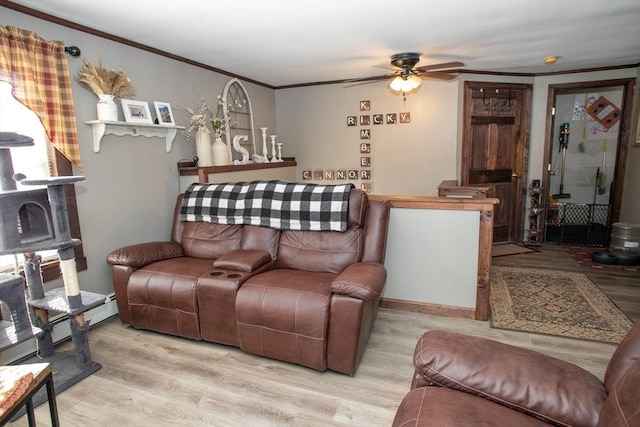 living room with a ceiling fan, wood finished floors, and crown molding