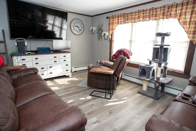 living room with light wood finished floors, ornamental molding, and a baseboard radiator