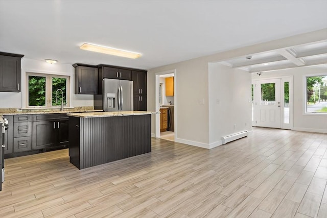 43 Water St, Freetown, MA 02702 - kitchen featuring stainless steel fridge with ice dispenser, baseboard heating, a center island, a sink, and light wood-style floors