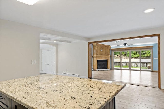 43 Water St, Freetown, MA 02702 - kitchen with a ceiling fan, beamed ceiling, a large fireplace, open floor plan, and a kitchen island