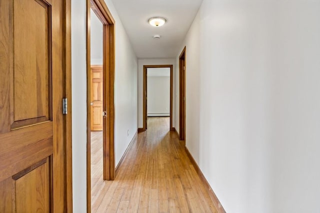 43 Water St, Freetown, MA 02702 - corridor with light wood-style flooring, a baseboard radiator, and baseboards