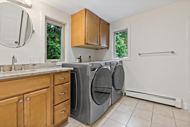 43 Water St, Freetown, MA 02702 - laundry room with a baseboard radiator, cabinet space, healthy amount of natural light, and light tile patterned floors
