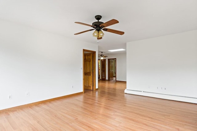 43 Water St, Freetown, MA 02702 - unfurnished room featuring ceiling fan, light wood-style flooring, a baseboard radiator, and baseboards