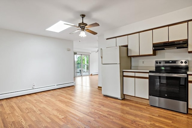 43 Water St, Freetown, MA 02702 - kitchen with electric stove, under cabinet range hood, freestanding refrigerator, a ceiling fan, and light wood-style floors