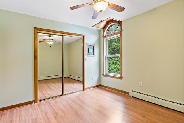 43 Water St, Freetown, MA 02702 - unfurnished bedroom with a baseboard heating unit, light wood finished floors, baseboards, a closet, and a ceiling fan