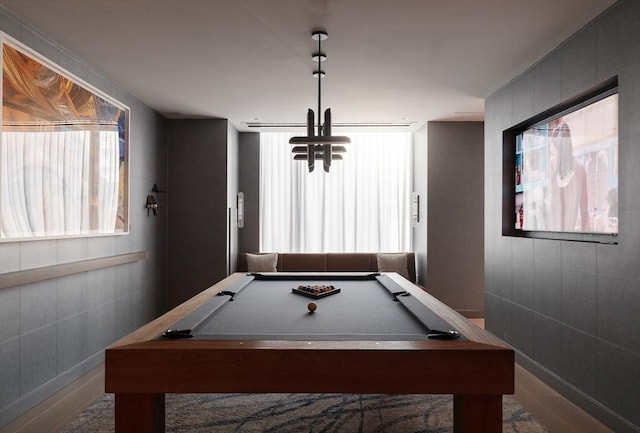 playroom with pool table, a healthy amount of sunlight, and wood-type flooring