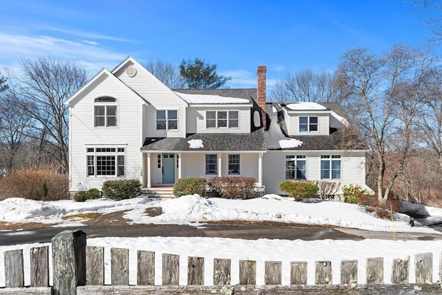 traditional-style house featuring a chimney