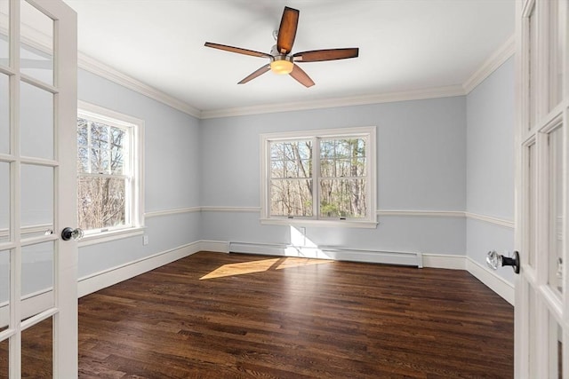 empty room featuring wood finished floors, baseboards, ceiling fan, ornamental molding, and a baseboard heating unit