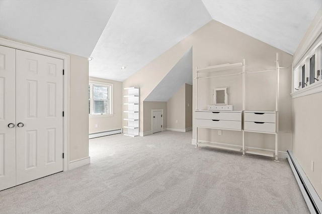 bonus room with vaulted ceiling, baseboard heating, carpet floors, and a baseboard radiator