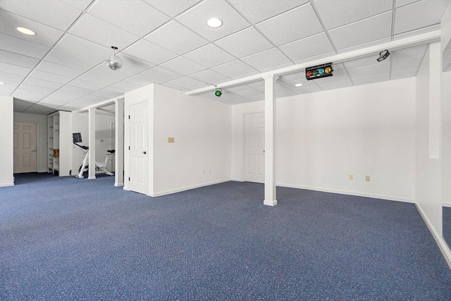 finished below grade area featuring recessed lighting, baseboards, dark colored carpet, and a drop ceiling