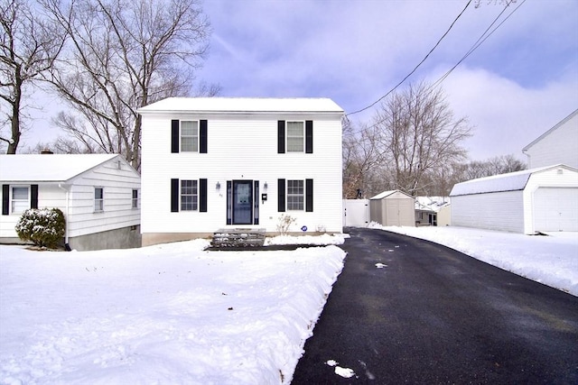 view of front of house featuring a shed and a garage