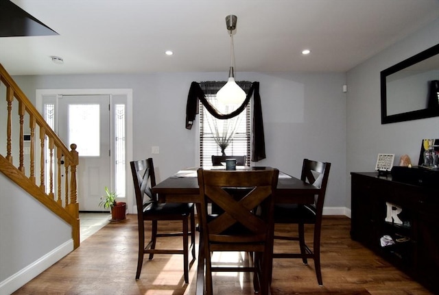 dining area with hardwood / wood-style floors