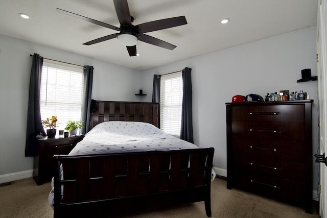 bedroom featuring ceiling fan and light colored carpet